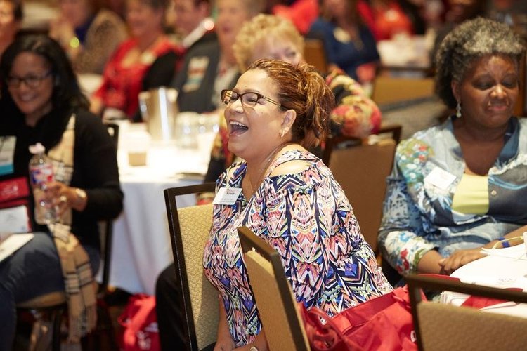 Audience members laughing during one of Sam’s presentations